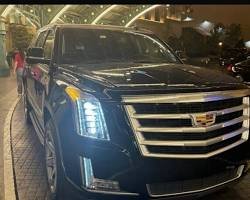 Cadillac Escalade at night for Chase Center pickup